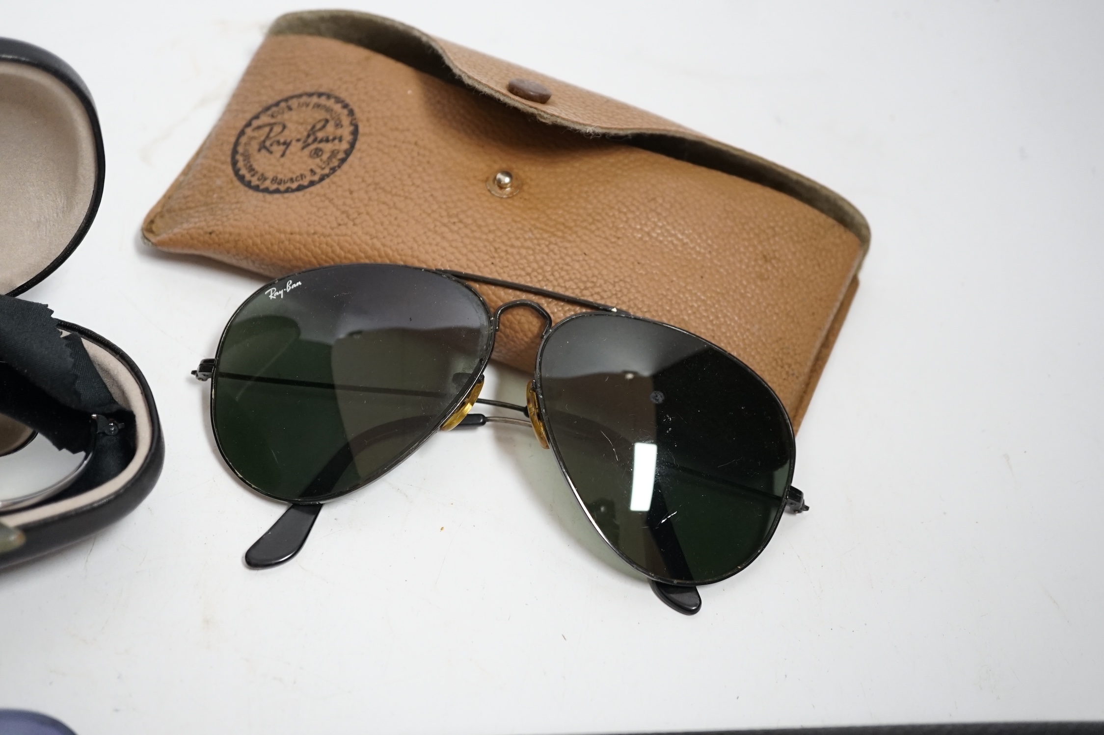 A collection of vintage Ray-Bans and other sunglasses